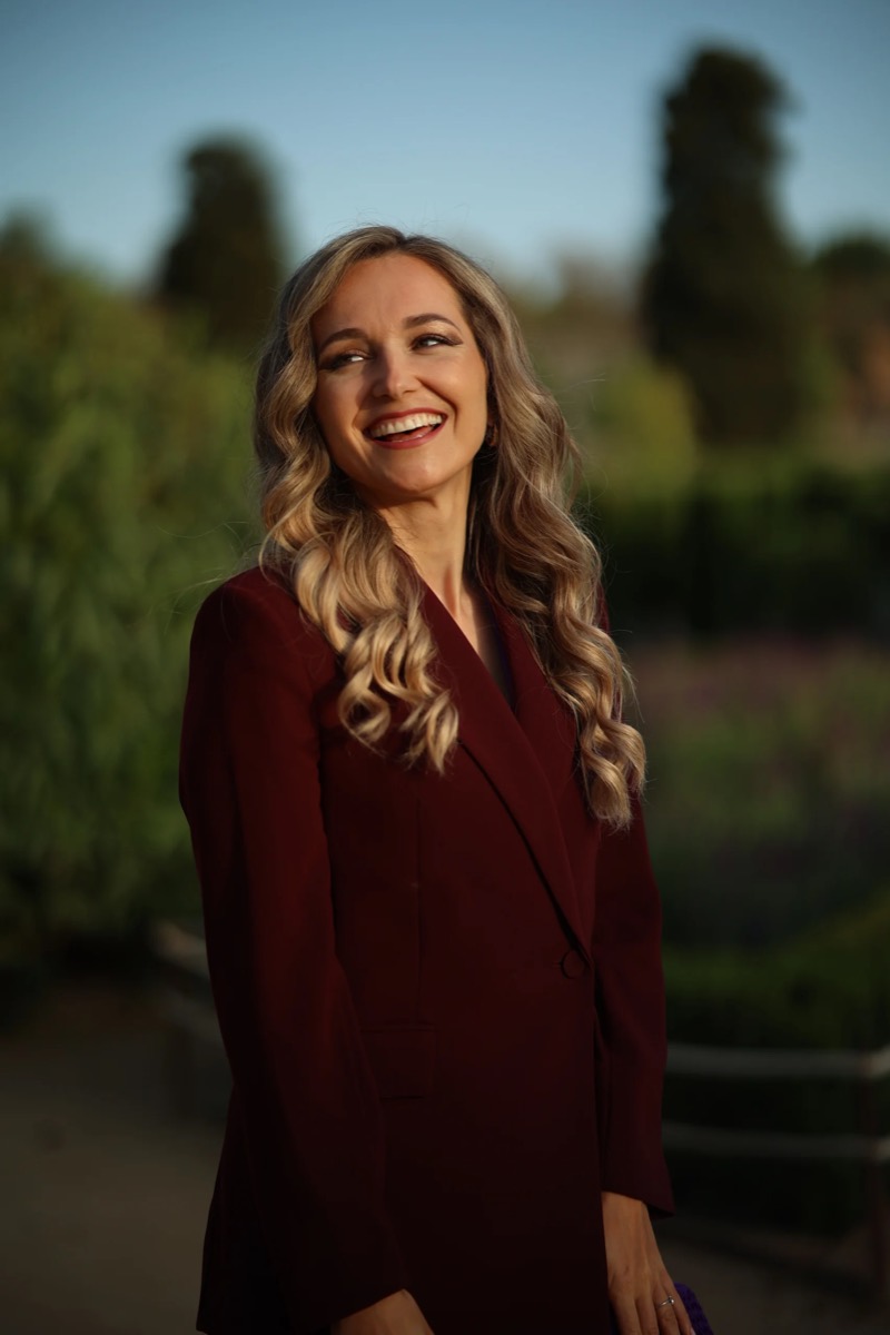 Katya de Fredericksz smiling outdoors